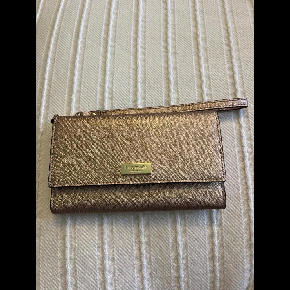 Kate spade tri fold  wristlet with  cell phone holder .